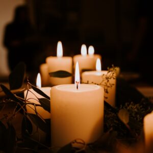 white pillar candles on black holder